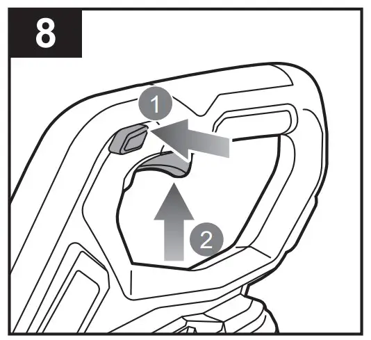 Press and hold the lock-out trigger