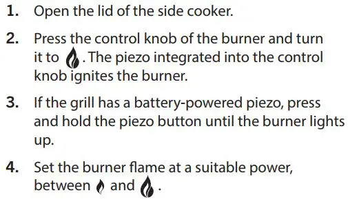 FIG 25 Igniting the burner of the side cooker.JPG