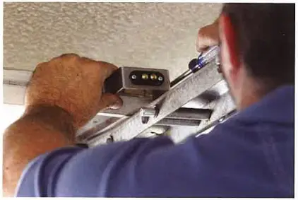 Remount door bracket to holes using 2 screws Figure 2