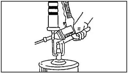 Filling the grease gun with a filler pump